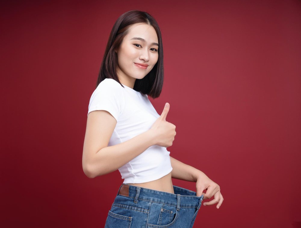 A woman celebrating weight loss